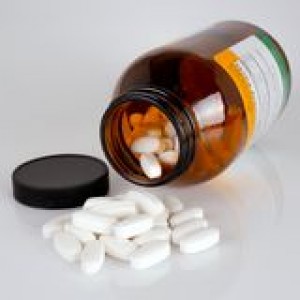 vitamin-pills-glossy-background-44343088